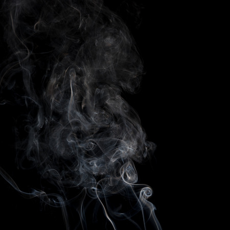 Movement of white smoke on black backgroundの写真素材