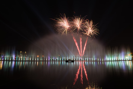fireworks with reflection in the lakeの写真素材