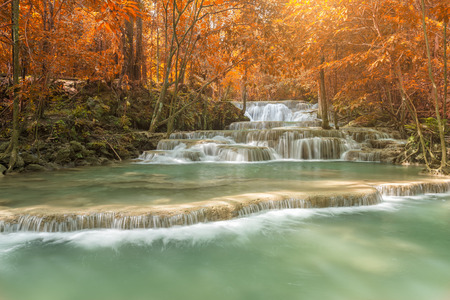 beautiful waterfall in autumn forest