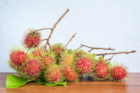 Close-up Rambutan on a wood tableの写真素材