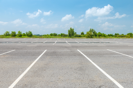 Empty parking lot against a beautiful blue skyの写真素材