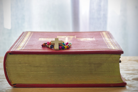Catholic rosary beads and bible