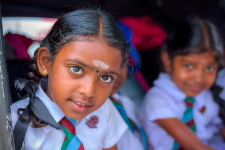 KANDY, SRI LANKA - MARCH 17, 2016: Children smiling on the car before go to school and looking at camera on March 17, 2016 in Kandy, Sri Lanka.のeditorial素材
