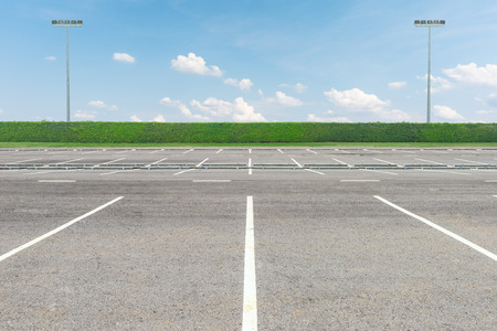 Empty parking lot against a beautiful blue skyの写真素材