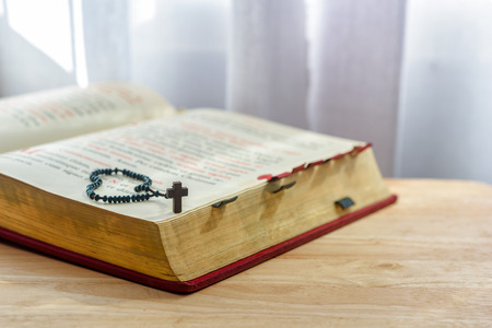 Catholic rosary beads and bible