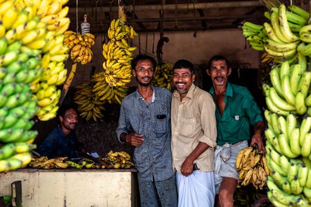 Aluva, India - May 15, 2018 : Men selling banana in a street market in the city of Aluva in Kerala, India.のeditorial素材