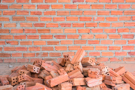 Pile of bricks with wall texture background.の写真素材