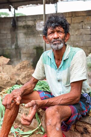 KANDY, SRI LANKA - MARCH 16 : Portrait of close up of long beard and mustache man stand at market on March 16, 2016 in Kandy, Sri lanka.のeditorial素材
