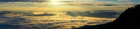 Panoramic foggy landscape with mountains in morning