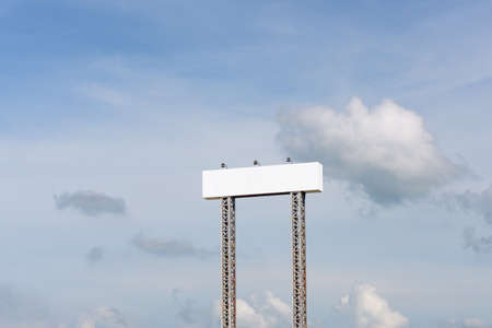 Blank white billboard against the blue skyの写真素材