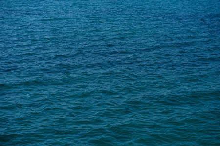 Blue sea surface texture backgroundの写真素材