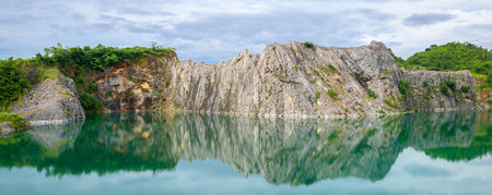 Panoramic beautiful lake and rock cliff in deep forest