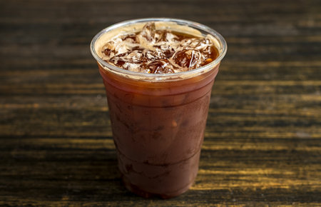 Americano ice coffee on wooden background. readyの写真素材