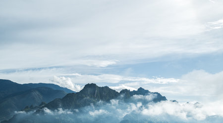 Beautiful mountain in deep countryside. Foggy clouds above tree. nature backgroundの写真素材