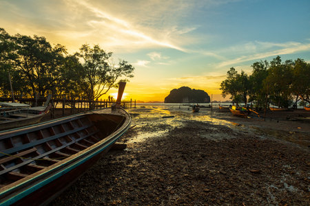 Beautiful outdoor landscape at sunset. The nature of the tropical seascape with fishing boat.の写真素材