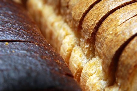 Loaf brown and white breads, cut hunksの写真素材