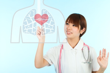Beautiful asian nurse and heartの写真素材