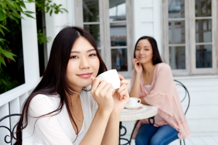 Beautiful young business woman drinking teaの写真素材
