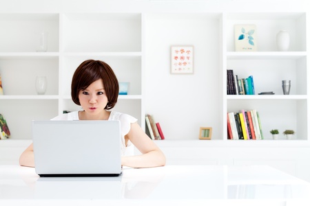Beautiful young woman using a laptop  Portrait of asian の写真素材