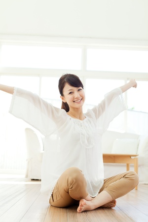 Beautiful young woman relaxing in the room  Portrait of asian の写真素材