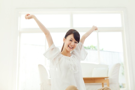 Beautiful young woman relaxing in the room  Portrait of asian の写真素材