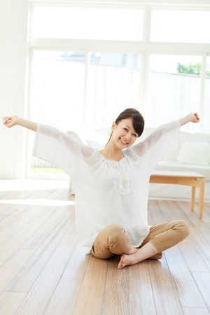 Beautiful young woman relaxing in the room  Portrait of asian の写真素材