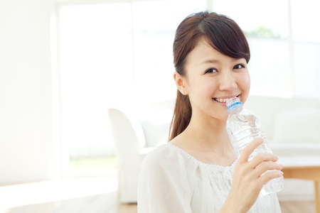 Beautiful young woman relaxing in the room  Portrait of asian の写真素材