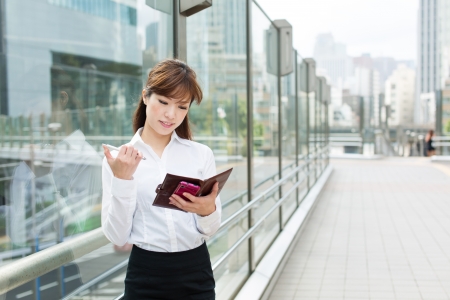 Beautiful business woman walking outside her officeの写真素材