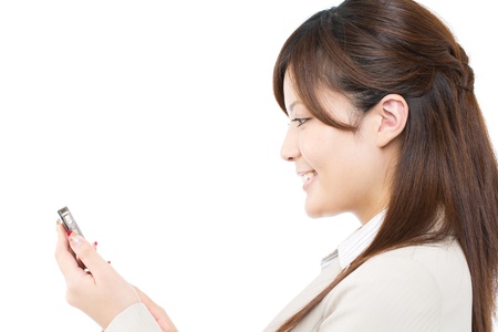 Beautiful businesswoman using a cellular phoneの写真素材