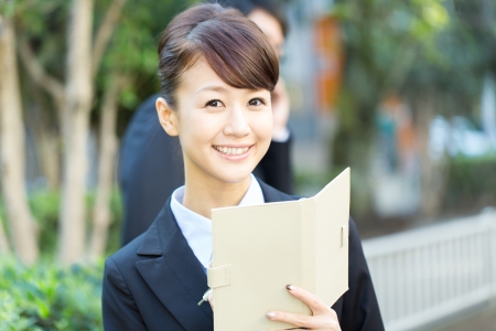 Young asian smiling businesswoman and businessmanの写真素材