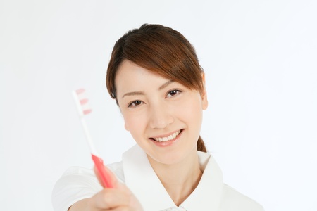 Beautiful asian nurse on white backgroundの写真素材