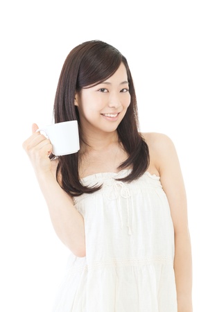 Beautiful asian woman drinking coffee on white backgroundの写真素材