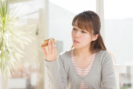 Beautiful young woman relaxing roomの写真素材