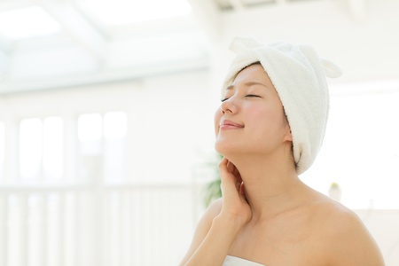 Beautiful asian woman relaxing in the roomの写真素材