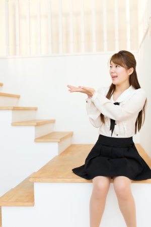 Beautiful asian woman relaxing in the roomの写真素材