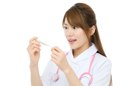 Beautiful asian nurse on white backgroundの写真素材