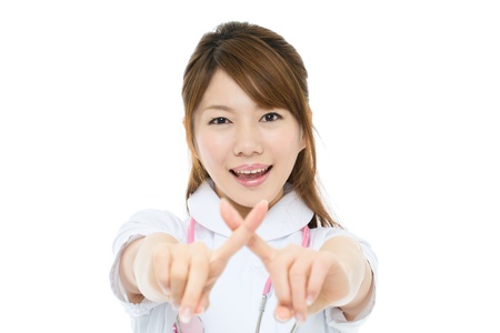 Beautiful asian nurse on white backgroundの写真素材