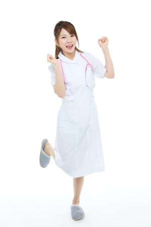 Beautiful asian nurse on white backgroundの写真素材