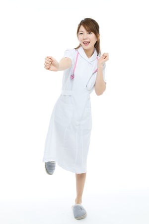 Beautiful asian nurse on white backgroundの写真素材