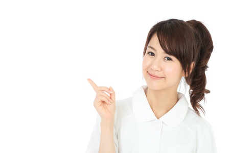 Beautiful asian nurse on white backgroundの写真素材