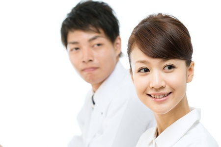 Asian young medical doctor isolated on white backgroundの写真素材