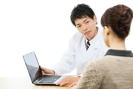 Asian young medical doctor isolated on white backgroundの写真素材