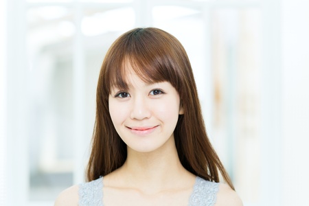 Beautiful asian woman relaxing in the roomの写真素材
