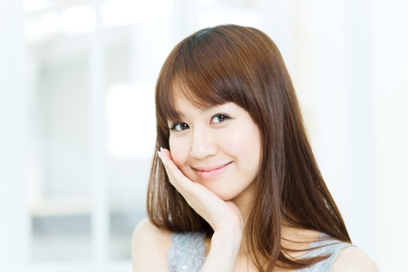 Beautiful asian woman relaxing in the roomの写真素材