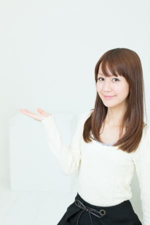 Beautiful asian woman relaxing in the roomの写真素材