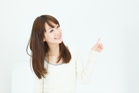 Beautiful asian woman relaxing in the roomの写真素材