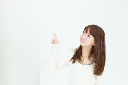 Beautiful asian woman relaxing in the roomの写真素材