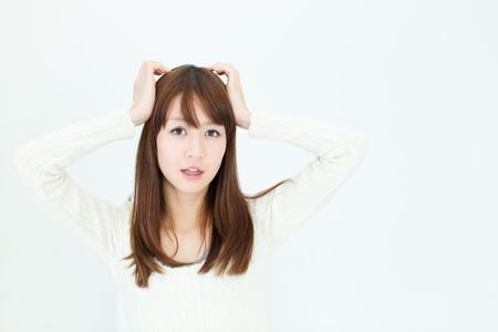 Beautiful asian woman thinkingの写真素材