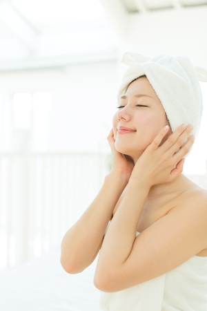 Beautiful asian woman relaxing in the room の写真素材