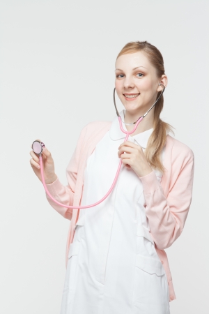 Beautiful caucasian nurse on white backgroundの写真素材